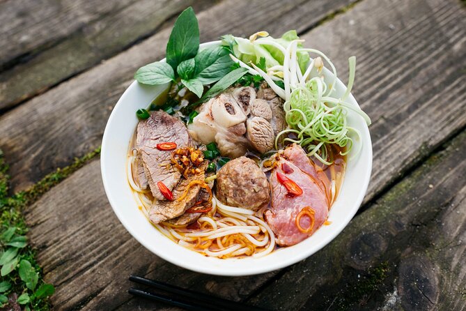 12 Tasting Street Food & Sightseeing By Scooter with Student - Getting started: pickup, mobile ticket, and staying safe on the road