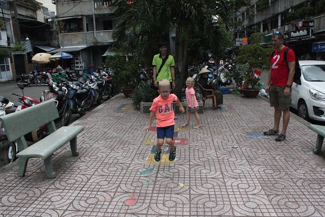 Afternoon Saigon Unseen Adventure by Scooter |Opt: Ao Dai Riders - Entering Saigon’s back alleys by scooter