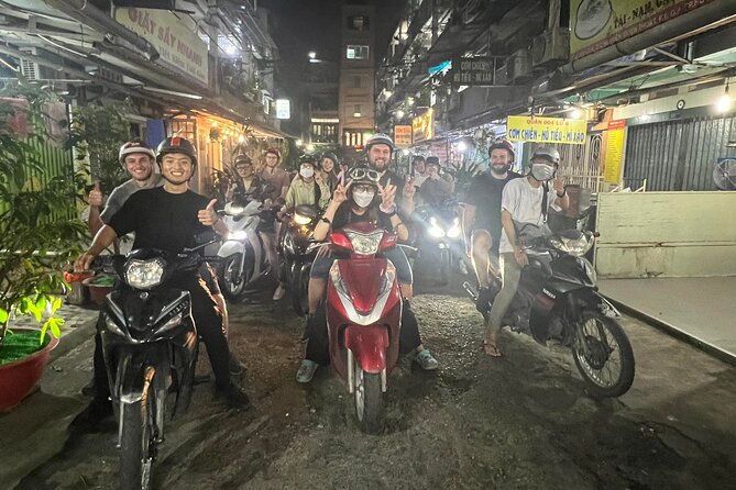 Ho Chi Minh Street Food Tour By Motorbike (Unique & Authentic) - Stop 3 (Chợ Lớn / District 5): winding toward Chinatown food energy