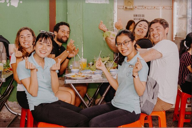 Saigon After Dark With Seafood, Beer & Live Music Bar - Mid-tour: rooftop bar drink and city views