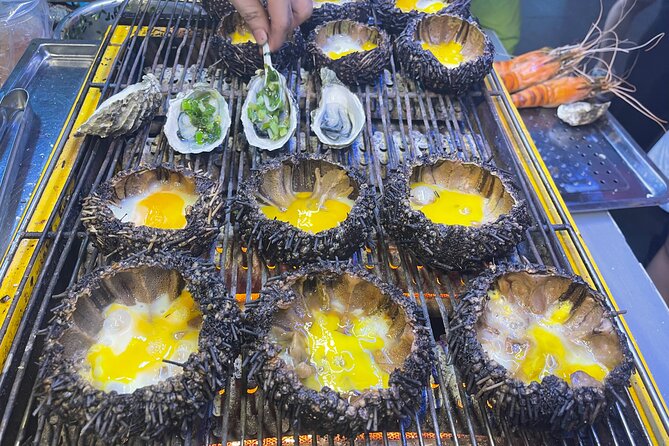 Saigon By Night and Street Food By Motorbike | Opt: Ao Dai Riders - Stop 2: Ho Thị Kỷ Flower Market oysters and that quail egg detail