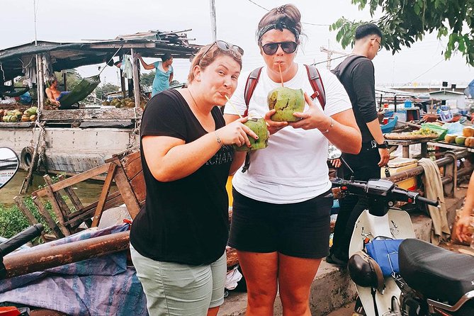 Saigon Night Sights & Local Food by Motorbike| Opt: Ao Dai Riders - District 4: floating-market energy and fruit smoothies