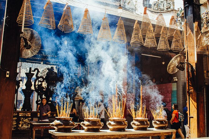 Saigon Unseen, History, & Hidden Gems Sightseeing Motorbike Tour - Chinatown in District 5 and an ancient temple: older Saigon’s quieter power
