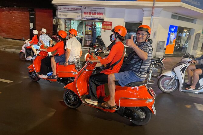 Saigon Vespa By Night Street Food With Female Riders Ao Dai - Music bar time: seeing how the next generation relaxes
